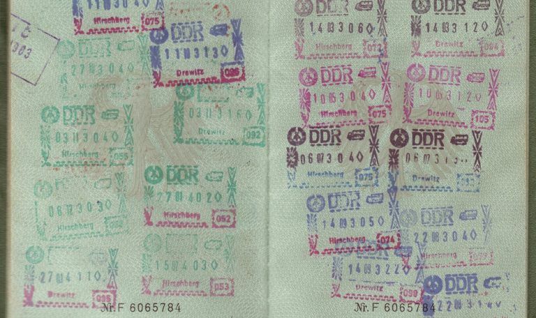Vietnam Visa Guide - Passport pages filled with immigration visa and entry stamps