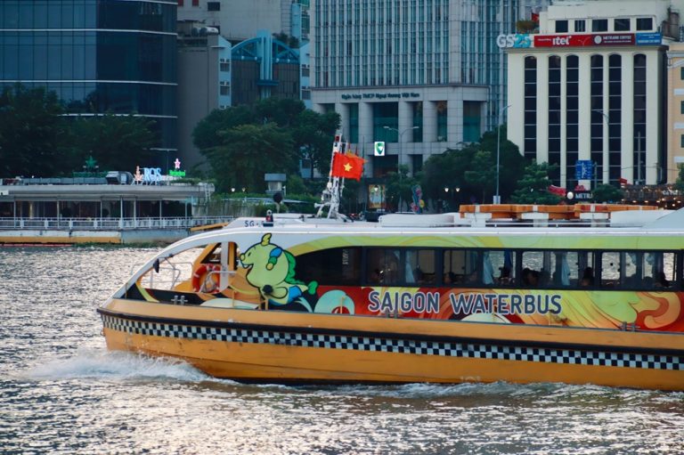 Saigon Waterbus travelling along the Saigon River with central Ho Chi Minh City in the background