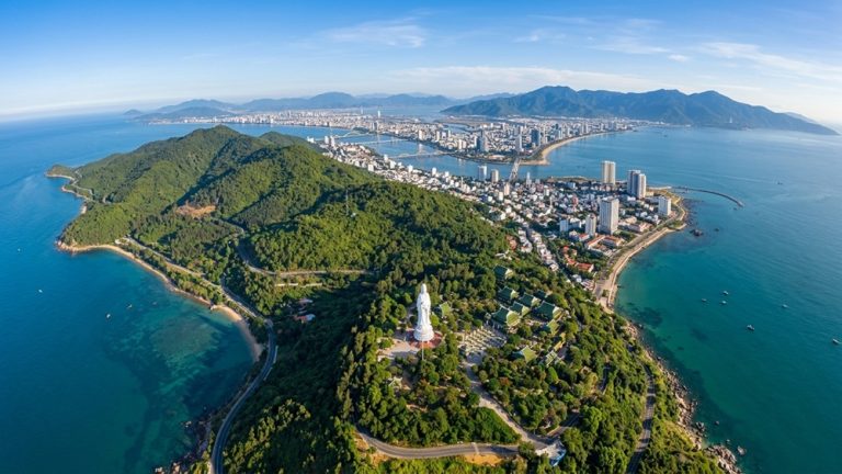 Aerial view of Son Tra Peninsula, Lady Buddha and the coastline of Da Nang Caption: Description:
