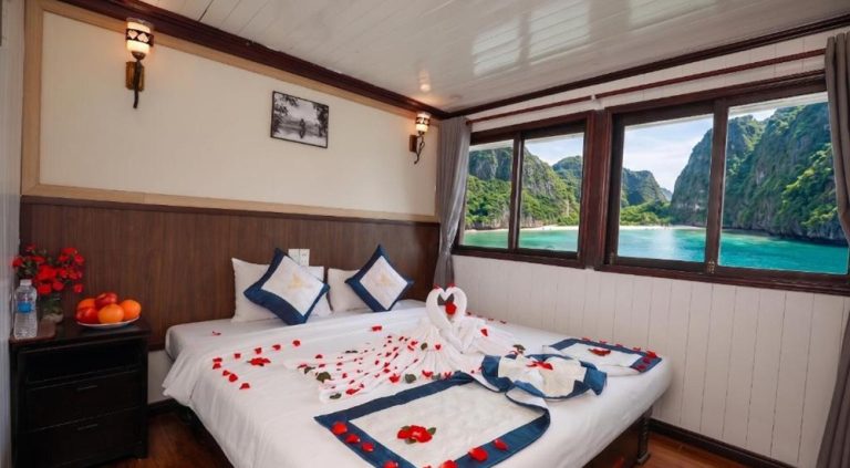 Luxury cabin aboard Sunlight Legend Cruise sailing through Ha Long Bay with panoramic views of the limestone islands