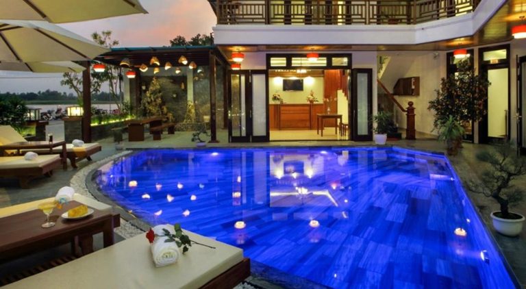 Outdoor swimming pool at Threeway Riverside Villa in Hoi An overlooking the Thu Bon River Caption Description