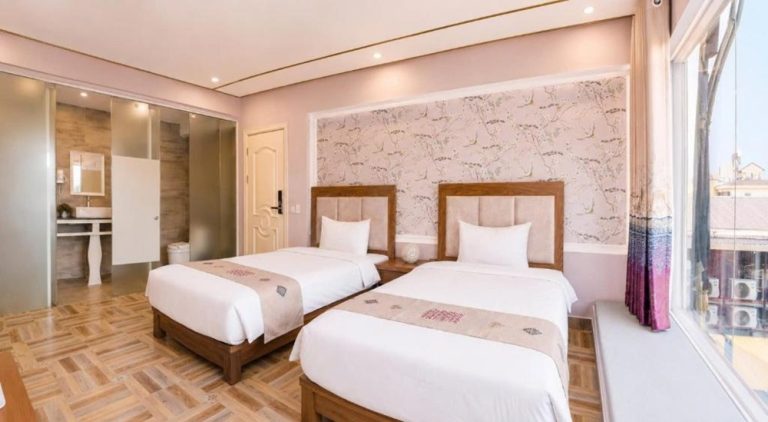 Modern guest room at Terravia Hotel Sapa Mountain View with comfortable twin beds in the heart of Sapa