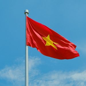 Vietnam Visa Guide - Vietnamese national flag flying against a clear blue sky