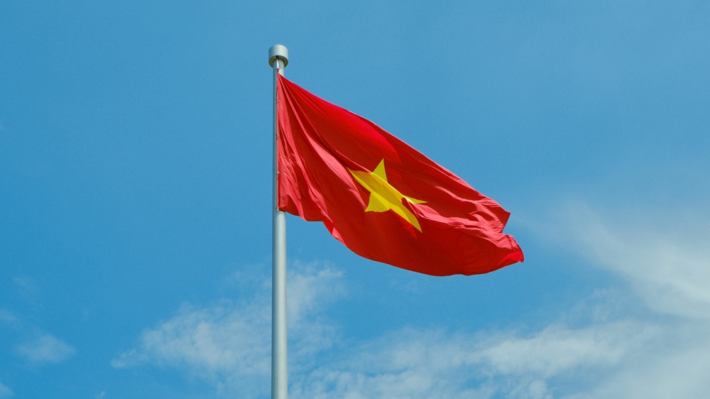 Vietnam Visa Guide - Vietnamese national flag flying against a clear blue sky