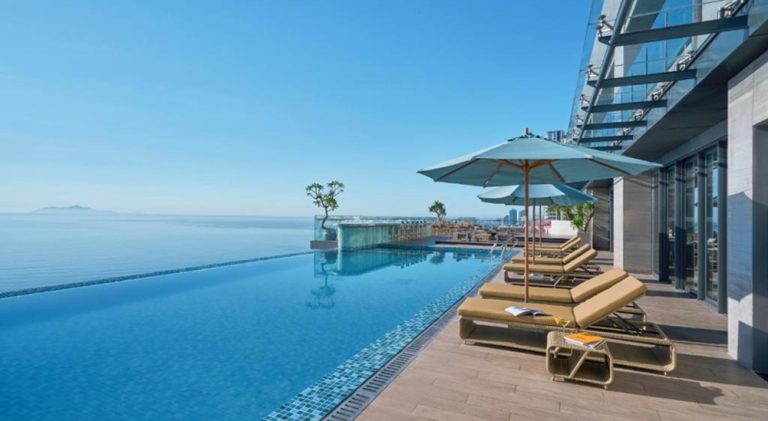 Rooftop infinity pool overlooking the sea at voco Ma Belle Danang in Da Nang, Vietnam