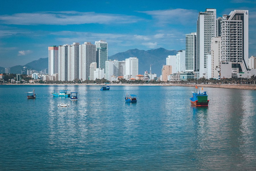 Things to do in Nha Trang - view across Nha Trang Bay with fishing boats and the beachfront skyline