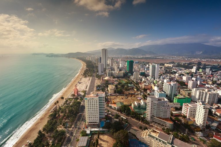 Panoramic view of Nha Trang with Tran Phu Beach, the city skyline and mountains along the Vietnamese coast Caption Description